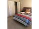 Bedroom with a bed, closet with bi-fold doors, and neutral-colored walls at 3046 Eastland Blvd # J106, Clearwater, FL 33761