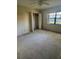 Bedroom featuring a closet, ceiling fan, and natural light from the window at 3046 Eastland Blvd # J106, Clearwater, FL 33761