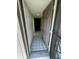Welcoming hallway features neutral paint, tile floors, and recessed lighting at 3046 Eastland Blvd # J106, Clearwater, FL 33761