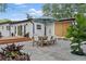 Outdoor patio featuring a dining table, chairs, and a spacious area perfect for entertaining at 3520 Poplar Ne St, St Petersburg, FL 33704