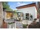 Spacious backyard patio and outdoor dining set, adjacent to a deck and lush landscaping, ideal for entertaining at 3520 Poplar Ne St, St Petersburg, FL 33704