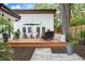 Inviting backyard with a wooden deck, patio, outdoor seating, and lush landscaping perfect for relaxing or entertaining at 3520 Poplar Ne St, St Petersburg, FL 33704