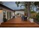 Inviting backyard featuring a deck, patio, and outdoor dining area; perfect for entertaining at 3520 Poplar Ne St, St Petersburg, FL 33704