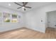 Bedroom features hardwood floors, ceiling fan, neutral paint, and a view from the window at 3520 Poplar Ne St, St Petersburg, FL 33704