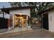 Beautiful garage space featuring watercraft storage and a backyard outdoor dining area at 3520 Poplar Ne St, St Petersburg, FL 33704