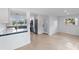 Open-concept kitchen features stainless steel appliances, granite counters and is open to the living area at 3520 Poplar Ne St, St Petersburg, FL 33704