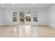 Bright living room with patio doors and a view to an outdoor deck and lots of natural light at 3520 Poplar Ne St, St Petersburg, FL 33704