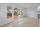 Bright living room with patio doors and a view to an outdoor deck and lots of natural light at 3520 Poplar Ne St, St Petersburg, FL 33704