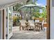 Outdoor patio features a dining table and chairs shaded by a large umbrella, perfect for entertaining guests at 3520 Poplar Ne St, St Petersburg, FL 33704