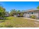Spacious backyard with a screened-in porch, shed, and well-maintained lawn, perfect for outdoor enjoyment at 3822 W Euclid Ave, Tampa, FL 33629