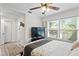Bedroom with large window providing natural light and ceiling fan at 3822 W Euclid Ave, Tampa, FL 33629