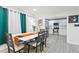 Elegant dining area with modern table and chairs, flowing into the kitchen space at 3822 W Euclid Ave, Tampa, FL 33629