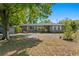 Attractive single-story home with lush landscaping, a large front yard, and a private driveway at 3822 W Euclid Ave, Tampa, FL 33629