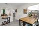 View of the Kitchen through a pass through with stainless refrigerator at 3822 W Euclid Ave, Tampa, FL 33629