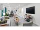 Bright, open-concept living room with stylish furniture, modern decor, and sleek flooring at 3822 W Euclid Ave, Tampa, FL 33629