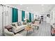 Inviting living room with modern furnishings, flowing into the dining area and kitchen at 3822 W Euclid Ave, Tampa, FL 33629
