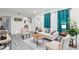 Cozy living room featuring comfortable seating, a stylish rug, and tasteful decor at 3822 W Euclid Ave, Tampa, FL 33629