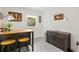 Small office nook features a desk, two stools, and a side cabinet at 3822 W Euclid Ave, Tampa, FL 33629
