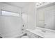Updated bathroom featuring a shower-tub combination with subway tile and a modern vanity at 402 Abigail Rd, Plant City, FL 33563