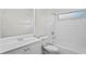 Updated bathroom featuring a shower-tub combination with subway tile and a modern vanity at 402 Abigail Rd, Plant City, FL 33563