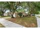 Well-maintained home with lush landscaping and mature trees at 402 Abigail Rd, Plant City, FL 33563