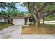 Charming single-Gathering home with attached garage and mature landscaping at 402 Abigail Rd, Plant City, FL 33563