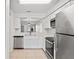 Beautiful kitchen with white cabinets, stainless appliances and backyard view at 402 Abigail Rd, Plant City, FL 33563