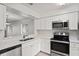 Well-equipped kitchen with stainless steel appliances and plenty of counter space at 402 Abigail Rd, Plant City, FL 33563
