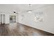 Bright living room featuring durable wood flooring and natural light at 402 Abigail Rd, Plant City, FL 33563