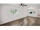 Open-concept living room with views of the kitchen and backyard at 402 Abigail Rd, Plant City, FL 33563