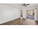 Comfortable living room area with sliding door to screened lanai at 402 Abigail Rd, Plant City, FL 33563