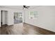 Spacious living room with sliding door access to the screened-in patio at 402 Abigail Rd, Plant City, FL 33563