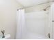 Bathroom interior with a white shower curtain, shower head, and toilet at 455 Alt 19 S Hwy # 81, Palm Harbor, FL 34683