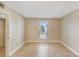 Spacious bedroom with neutral walls, tile flooring, and natural light at 455 Alt 19 S Hwy # 81, Palm Harbor, FL 34683