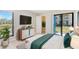 Bedroom featuring a large window view, modern dresser, and decor at 455 Alt 19 S Hwy # 81, Palm Harbor, FL 34683