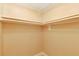 A well-organized walk-in closet with white shelving and rods offers ample storage space at 455 Alt 19 S Hwy # 81, Palm Harbor, FL 34683
