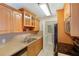 Well-equipped kitchen featuring sleek countertops, ample cabinetry, and essential appliances at 455 Alt 19 S Hwy # 81, Palm Harbor, FL 34683