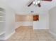 Open living space with neutral walls, tile flooring, and a ceiling fan at 455 Alt 19 S Hwy # 81, Palm Harbor, FL 34683