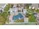 A stunning pool area with comfortable lounge chairs, palm trees, and a jacuzzi at 455 Alt 19 S Hwy # 81, Palm Harbor, FL 34683