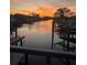 Sunset waterfront view along canal homes featuring boat docks at 4806 Bay Crest Dr, Tampa, FL 33615