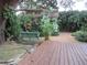 Tranquil backyard featuring a swing bench and a lush garden, ideal for relaxing and enjoying nature at 4904 E River Hills Dr, Tampa, FL 33617
