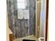 Nicely appointed bathroom featuring modern fixtures and a geometric wallpaper at 4904 E River Hills Dr, Tampa, FL 33617