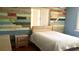 Bedroom featuring an accent wall and a light colored bed at 4904 E River Hills Dr, Tampa, FL 33617