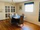 Inviting dining room with wood floors, a chandelier, and natural lighting at 4904 E River Hills Dr, Tampa, FL 33617