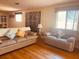 Comfortable living room featuring hardwood floors and bright natural light at 4904 E River Hills Dr, Tampa, FL 33617