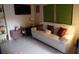 Bright living room with modern furniture, a TV, and decorative shelving at 4904 E River Hills Dr, Tampa, FL 33617
