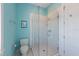 Bright bathroom featuring a glass-enclosed shower and charming beach-themed decor at 506 65Th St, Holmes Beach, FL 34217