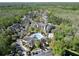 A high-angle shot reveals an apartment complex featuring a pool and clubhouse at 5125 Palm Springs Blvd # 9207, Tampa, FL 33647