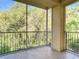 Relaxing screened patio featuring tile flooring and views of lush greenery at 5125 Palm Springs Blvd # 9207, Tampa, FL 33647