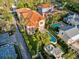 Beautiful aerial view showcasing home with pool, fountain, and manicured backyard at 608 Orange Ave, Clearwater, FL 33756